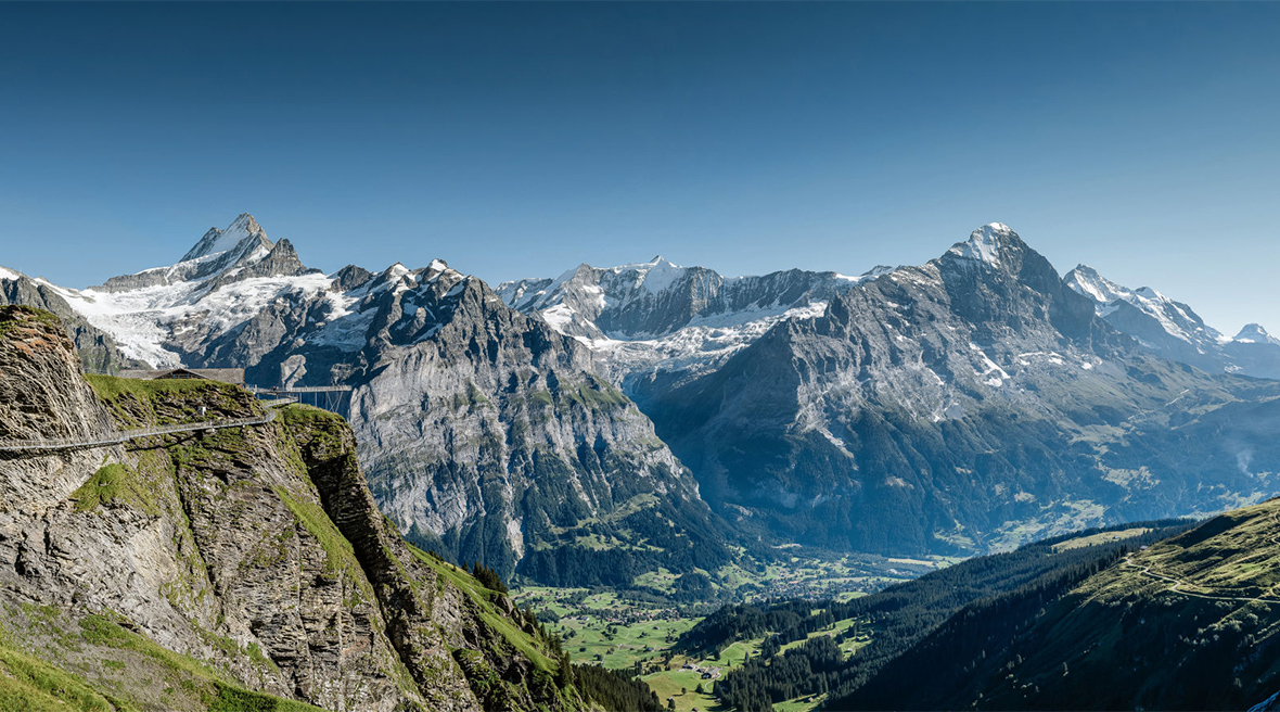 A manmade walkway snakes along the side of Grindelwald First mountain – the Eiger glacier in the background